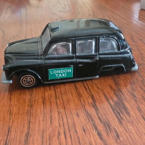 Collectible toy cars used, London Taxi and Valletta bus