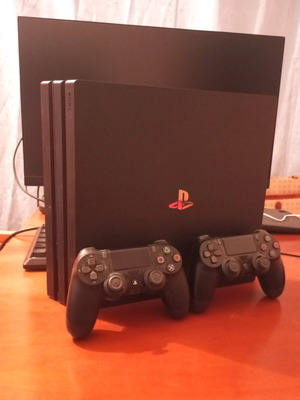 PlayStation 4 Pro like new with 2 controllers and 3 games of choice