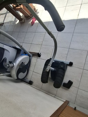 Step elliptical fitness machine used with small step counter screen
