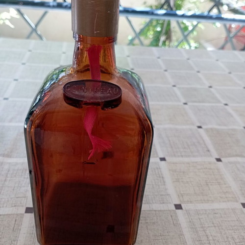 Cointreau collectible bottle, amber