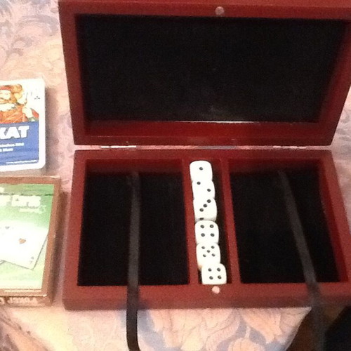 Wooden box with two new decks of cards and six dice with velvet lining