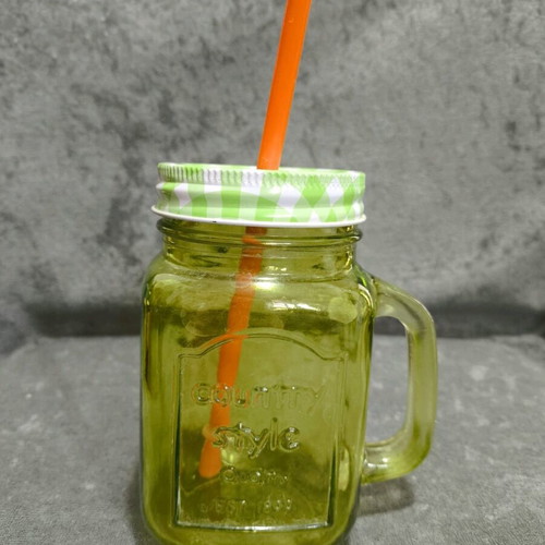 Glass cup with straw used, straw needs replacement