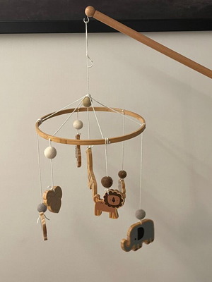 Wooden mobile with adjustable clamp used for baby changing table