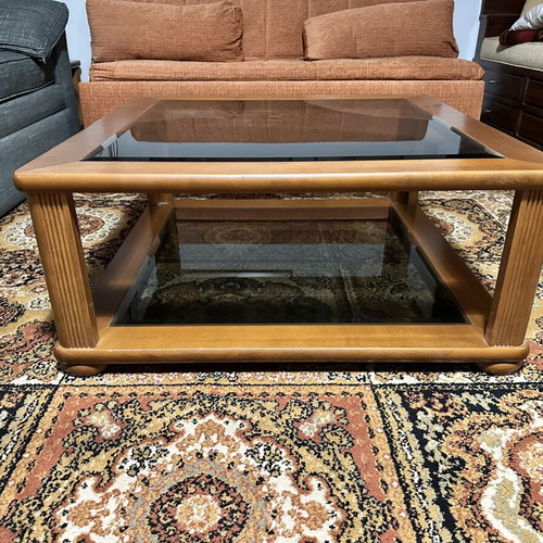 Set of two wooden square coffee tables with glass tops