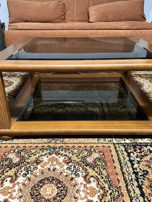 Set of two wooden square coffee tables with glass tops
