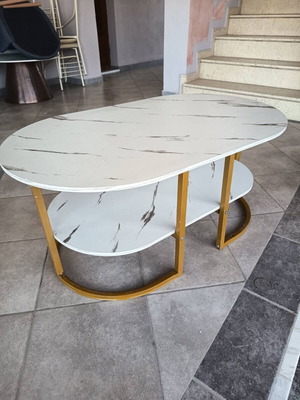 Oval coffee table with marble effect