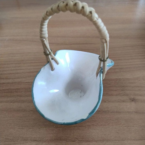 Decorative small ceramic basket used with wear marks