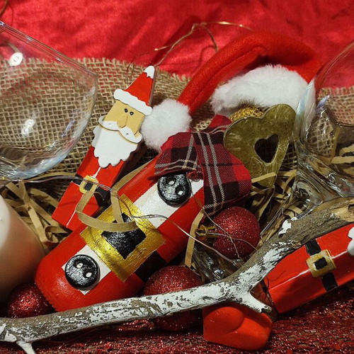 Christmas gift with wooden tray, wine bottle, glasses and decorations