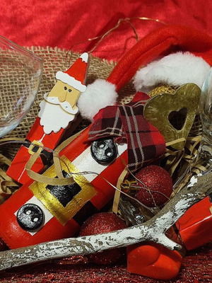 Christmas gift with wooden tray, wine bottle, glasses and decorations