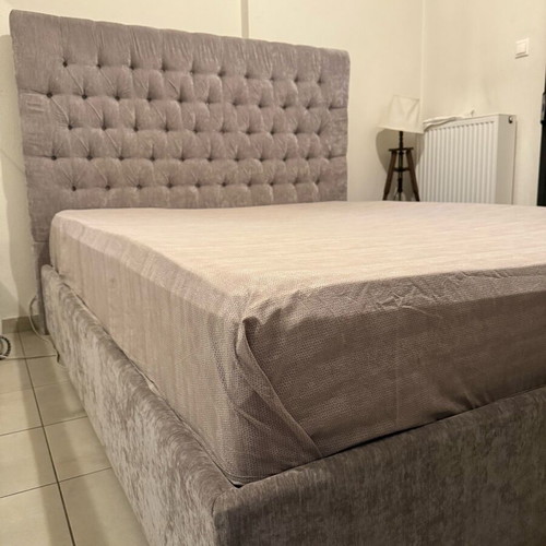 Double bed with water-repellent grey beige fabric and mattress like new