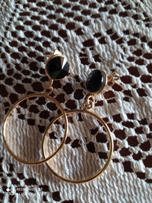 Earrings like new gold-colored stainless steel with black stones
