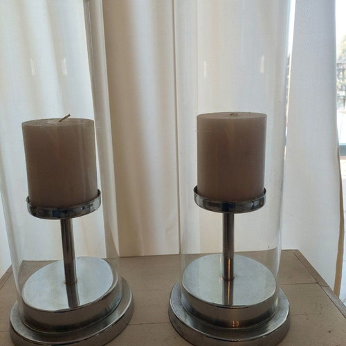 Set of 2 used candlesticks with silver frame and transparent glass