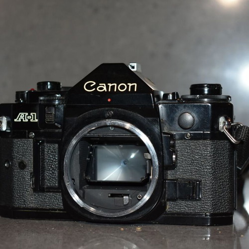 Canon A-1 collectible pack like new with Motor Drive, strap and 35mm f/2.8, 135mm lenses