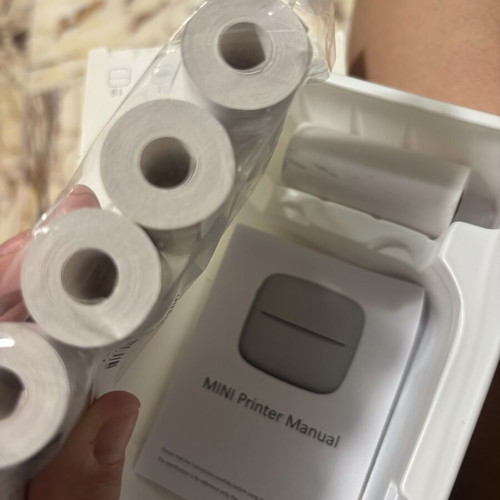 Mini printer like new with 6 rolls, cable and box