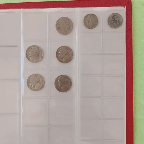 Coin album used with 5 slides for 133 coins