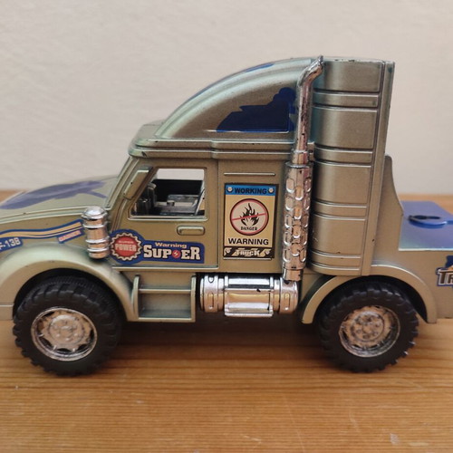 Toy Trucks pack of 3 used, including Cars-themed red truck