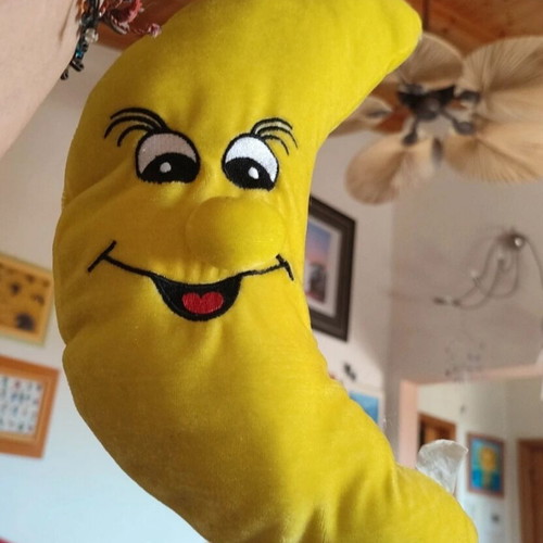 Crescent moon stuffed toy used with big smile