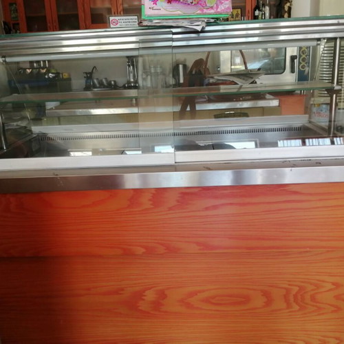 Double-sided glass display case for syrup desserts, shelf for 8 trays