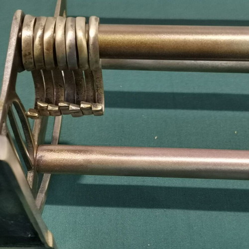 Brass wall-mounted hanger used