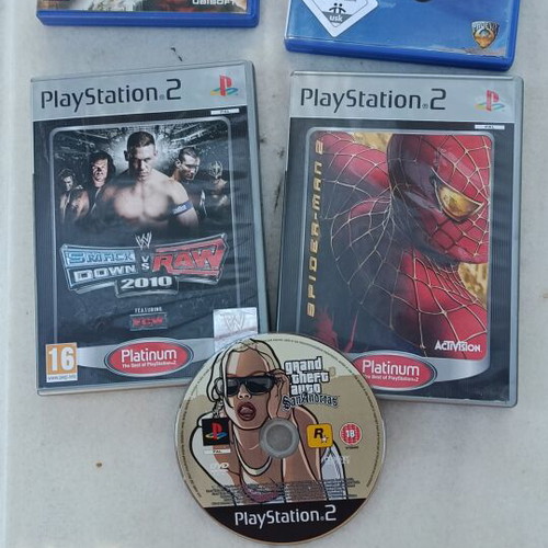 Sony PlayStation 2 slim console with 5 games, power supply and cables