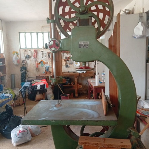 Bandsaw with planer, table, and bench used, includes tools