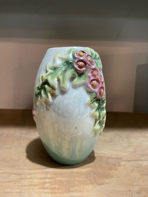 Porcelain vase used handmade with carved flowers