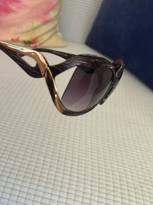 Sunglasses used with brown and gold design