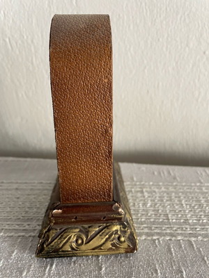 Vintage tabletop clock used, leather and carved wood