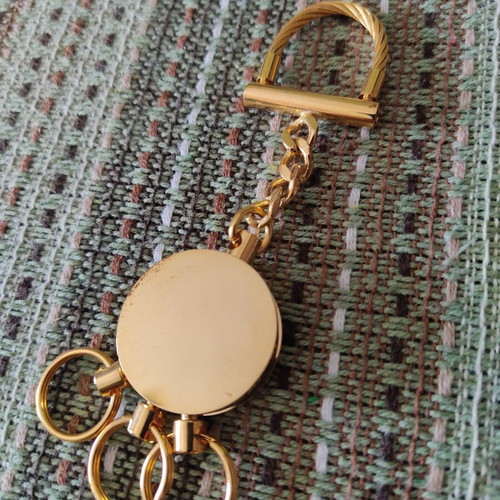 Deluxe keychain with case, like new, gold tone
