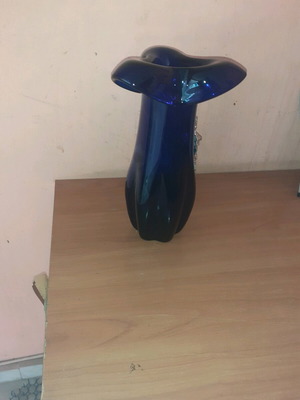 Vase like new dark blue with embossed front design