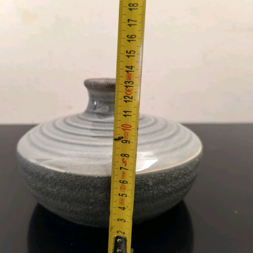 Ceramic low vase in gray shades like new