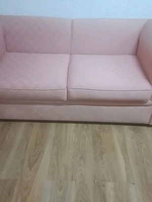 Vintage two-seater sofa used, salmon color in very good condition