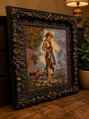 Old embroidery in wooden frame with rural scene