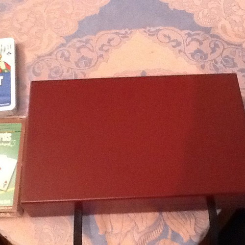 Wooden box with two new decks of cards and six dice with velvet lining