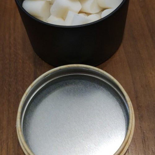 Wax melts in black matte metal container with choice of scent