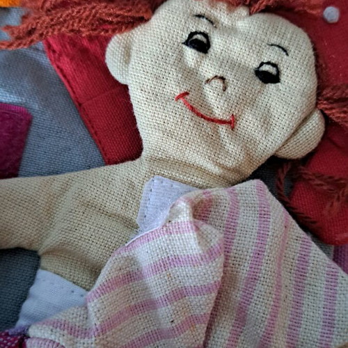 Cloth bag with doll and clothes used
