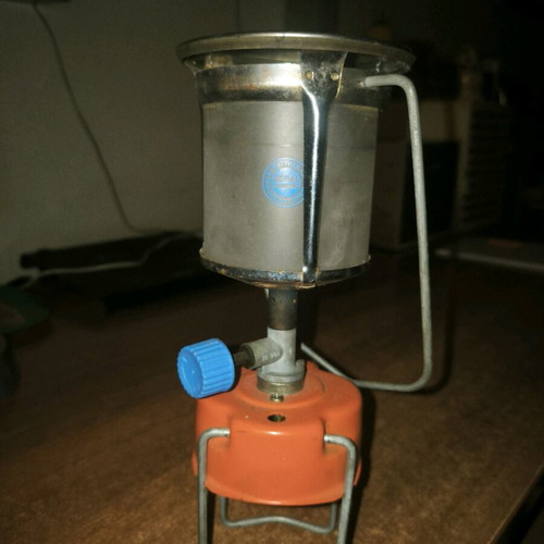 Camping gas lamp used with its protective cage