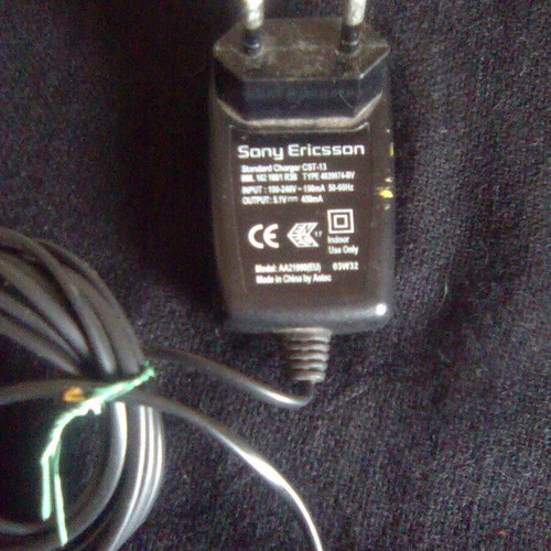 Sony Ericsson K700i used mobile phone with charger and headphones