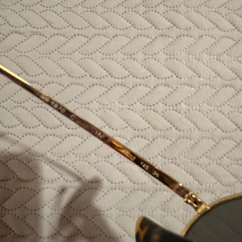 Ray-Ban Oval sunglasses used with gold frame and gray lenses