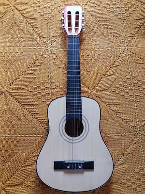Children's classical guitar used with nylon strings