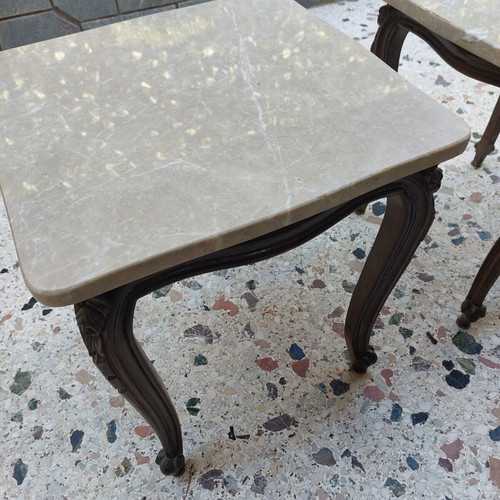 Vintage side tables pair with natural marble used
