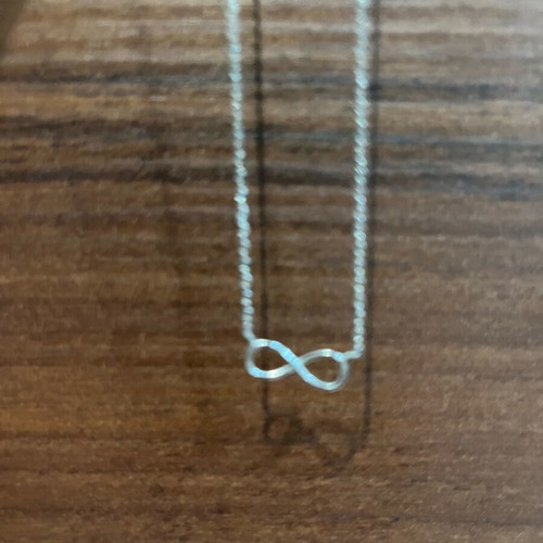 Necklace with infinity design like new, silver