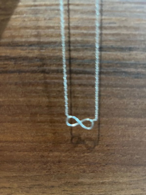 Necklace with infinity design like new, silver