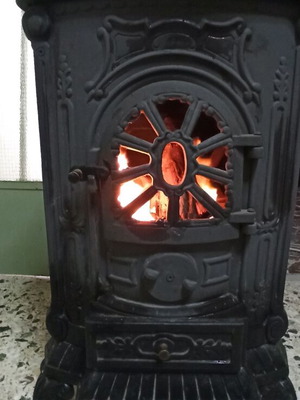 Cast iron wood stove used with pipes