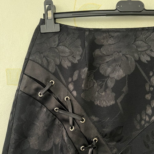 A-Style black skirt with floral pattern and satin detail, new