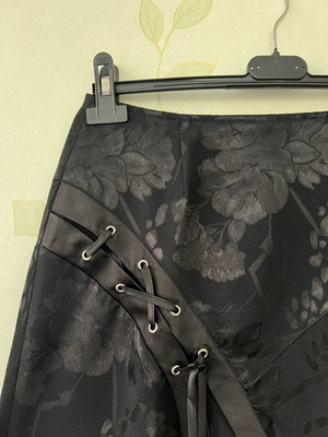 A-Style black skirt with floral pattern and satin detail, new