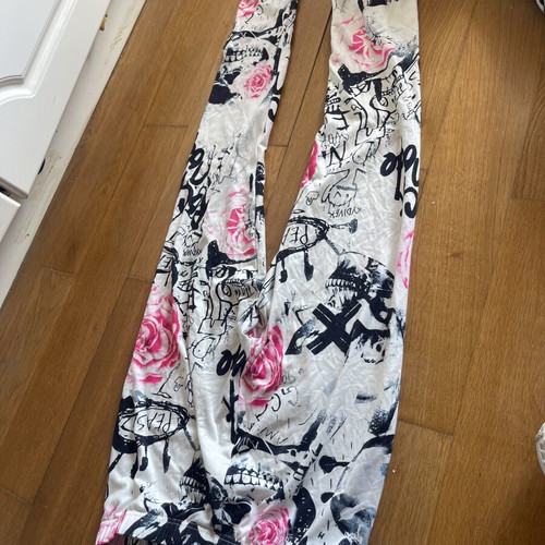 Leggings used, khaki camouflage and white with pink and black patterns, set of two