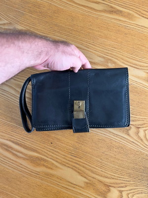 Vintage unisex black leather clutch bag with bronze clasp