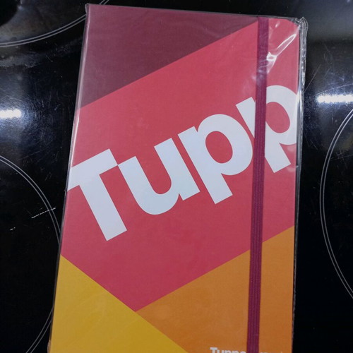 Tupperware notebook new with hard cover and elastic band