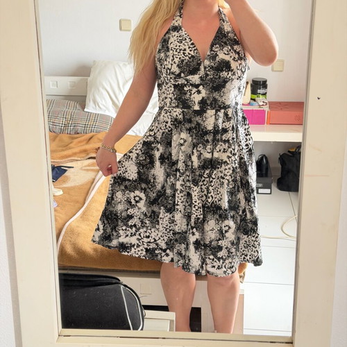 Vintage women's midi dress with halter neckline and black and white floral pattern used